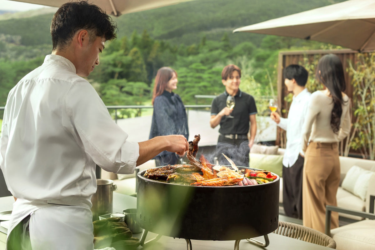 Dedicated chef grilling BBQ on the suite terrace